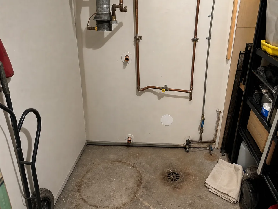 The utility room after the old water heater was removed.